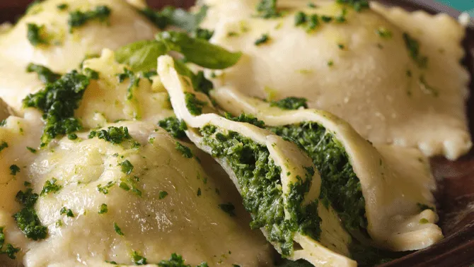 Handmade ravioli with ricotta and spinach at a pasta class in Milan